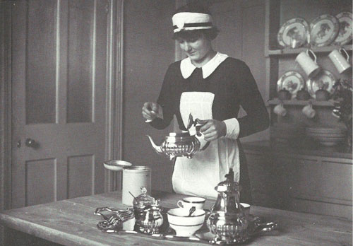 Maid pouring afternoon tea